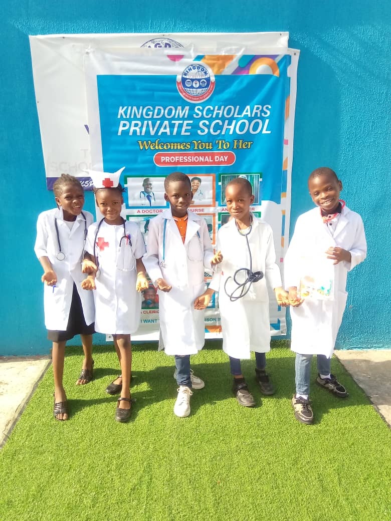 Professional Day — learners in white coats at KSPS banner